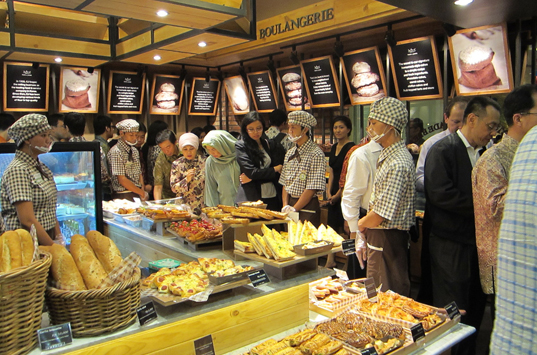 Customers crowd into the 1st Tour Les Jours store in Indonesia 2